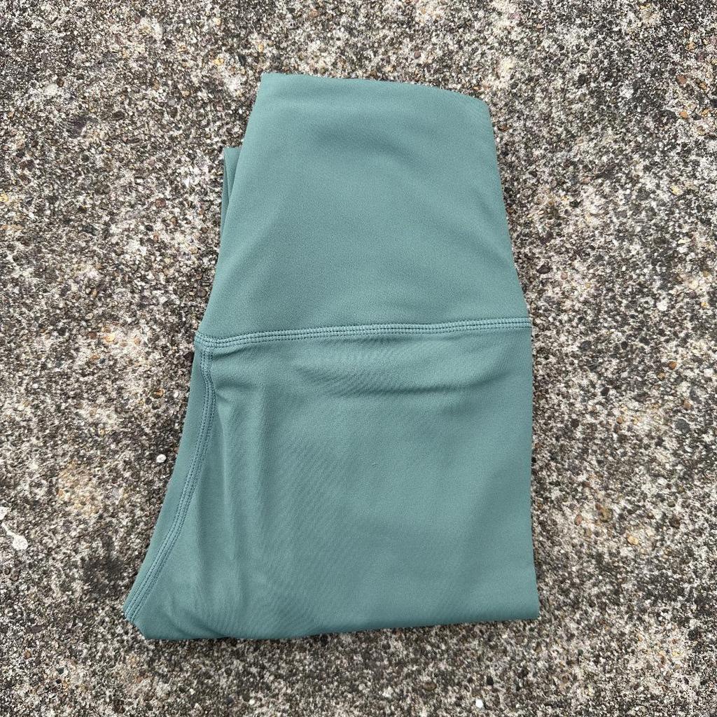 Solid Color High-Waisted Women's Yoga Leggings with Back Pocket – Soft, Elastic, and Peach Bum Enhancing