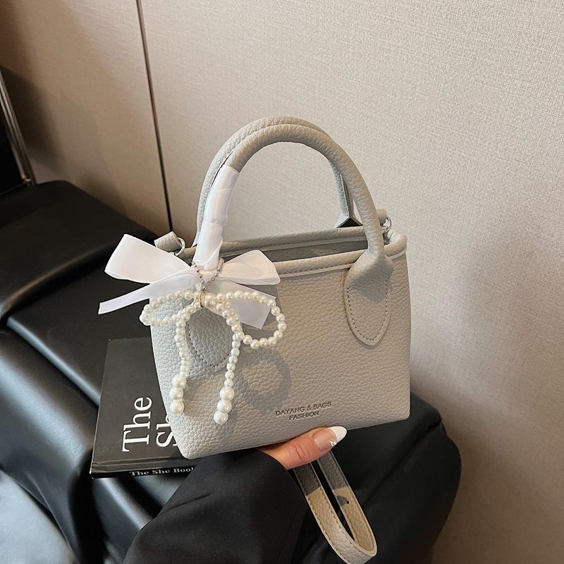 2025 nová mašle perlová kabelka dámská móda ležérní svěží jednoduchá ramenní crossbody niche design taška