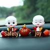 Creative Little Monk Maitreya Buddha Car Ornament: Cute, Shaking Head Resin Doll for Car Interior Decoration and Safety.