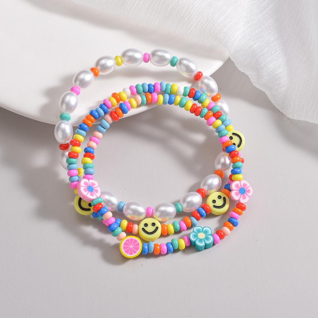 3-piece set of Bohemian style colorful rice beads mixed with smiling face pearls, multiple layered women's anklets