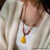 Elegant Handmade Amber Gold Pendant Necklace with Eight Treasures Compass Safety Buckle and Jade Pendant Rope