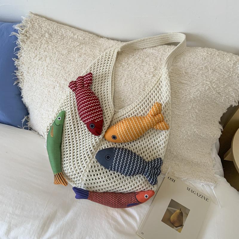 Niche bag women's large-capacity new summer leisure shoulder knitted woven bag commuter tote bag