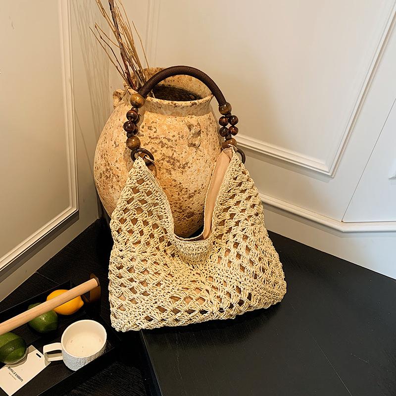 

Вязаная соломенная сумка большой вместимости женская летняя новая нишевый дизайн на плечо приморский отпуск пляжная сумка бежевый