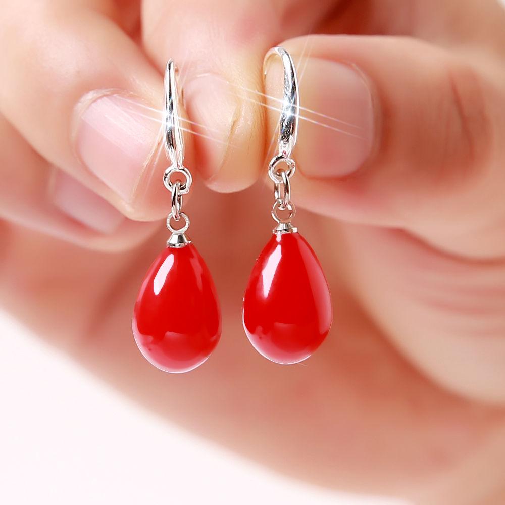 

Women s Dangling Earrings with Red Pearls