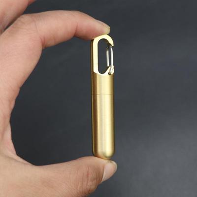 Compact Brass Pill Bottle: Waterproof, Dustproof, Moisture-Proof Storage Jar with Key Hook - Ideal for Travel or Everyday Use.