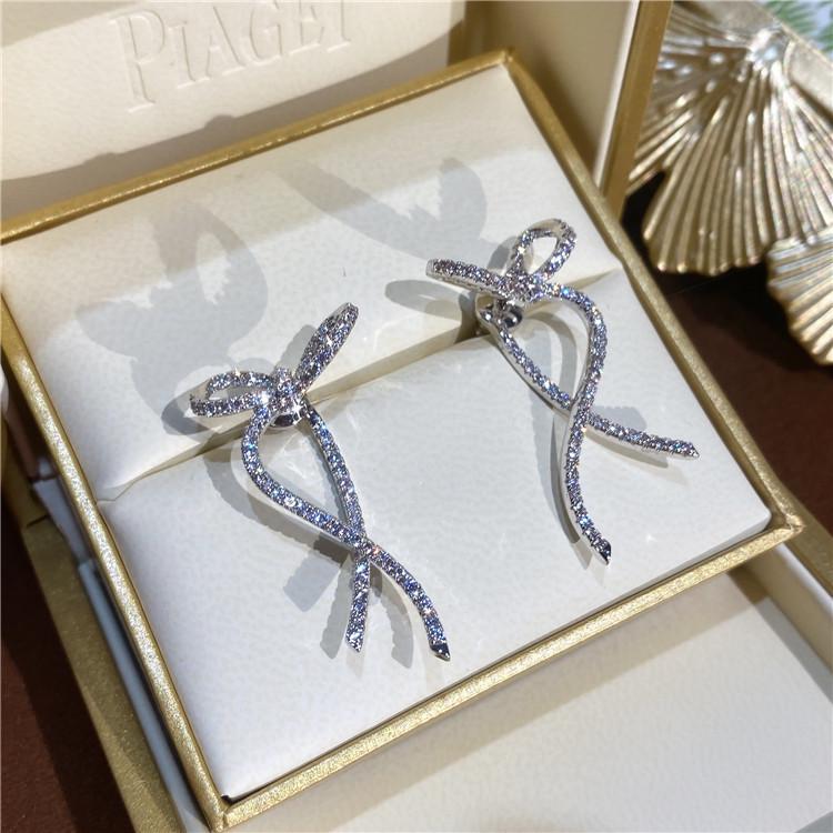 

Korean Bow Design S925 Silver Stud Earrings with Inlaid Diamonds