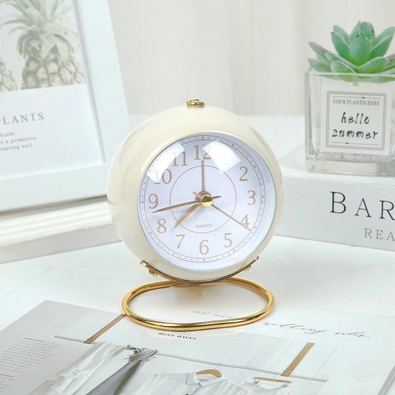 Silent Metal Alarm Clock with Night Light and Gold Stamped Spherical Face - Perfect for Students and Children.