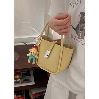 Nische einfache handgetragene Eimertasche Damen Frühling Neu Hochwertige Gemüsekörbchen-Tasche Modische Schulter-Umhängetasche