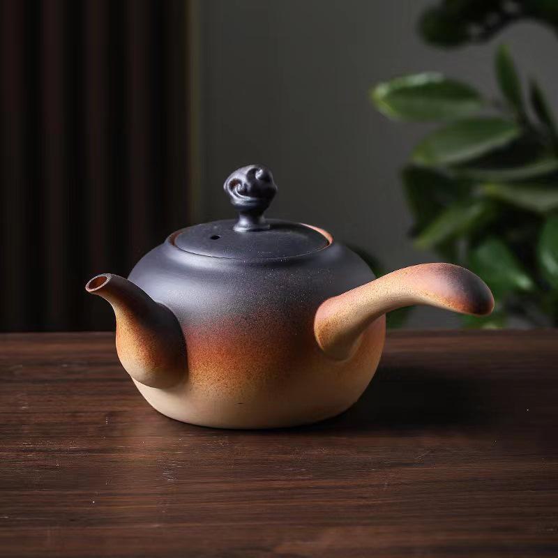 Ceramic Kung Fu Tea Set: Black Teapot with Side Handle and Charcoal Stove for Open Fire.