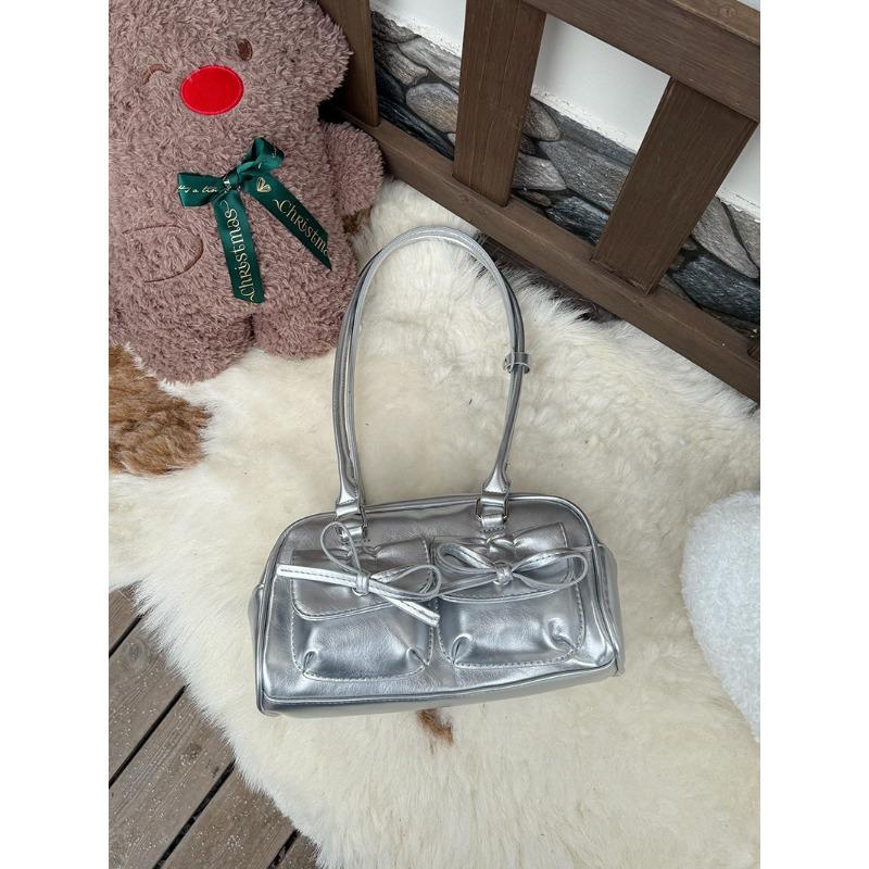 

Bow shoulder armpit bag women s new black texture portable bowling bag fashion commuter bag серебряный