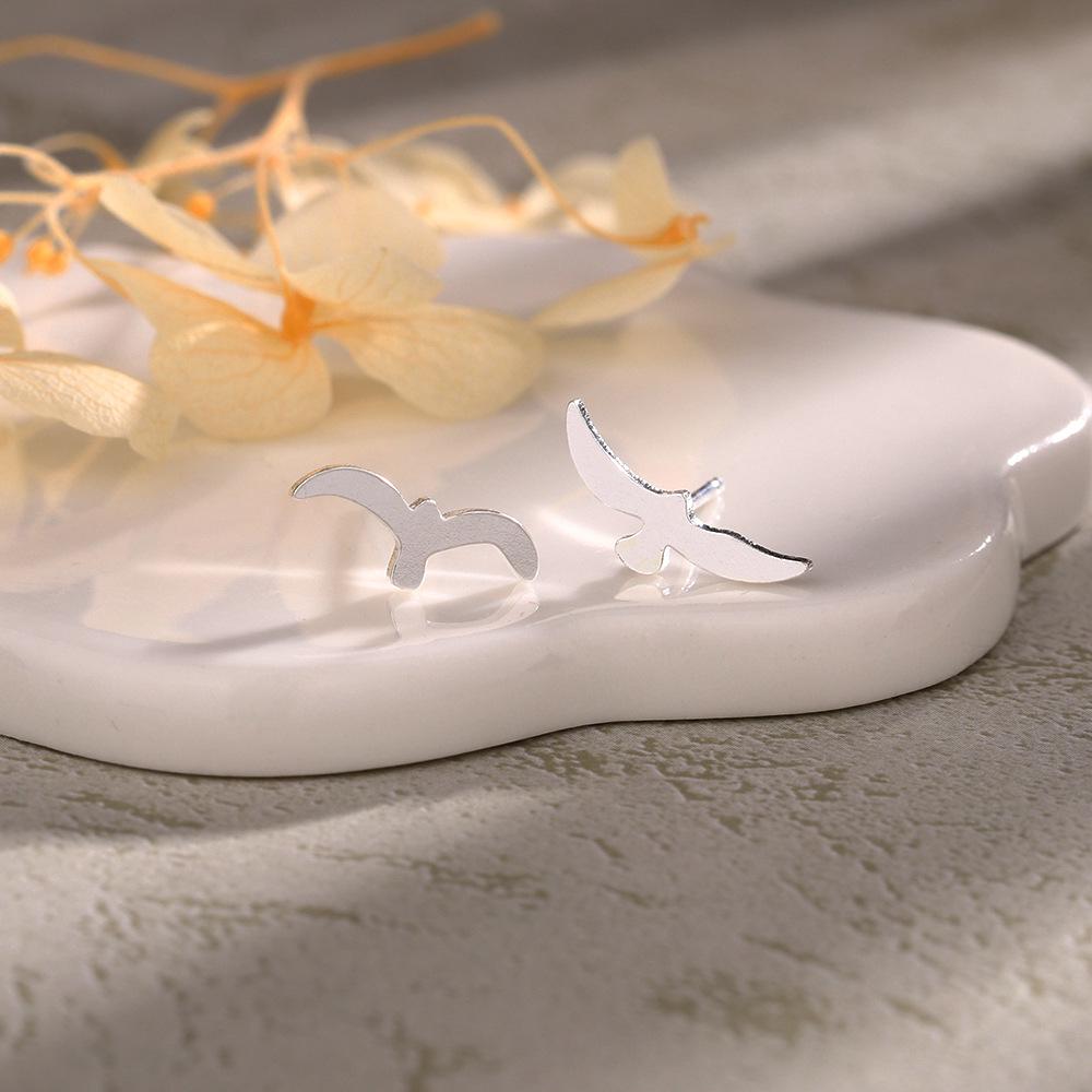 

Asymmetrical Seagull Earrings: Unique Unisex Ocean-Inspired Design Copper with Ear Stopper