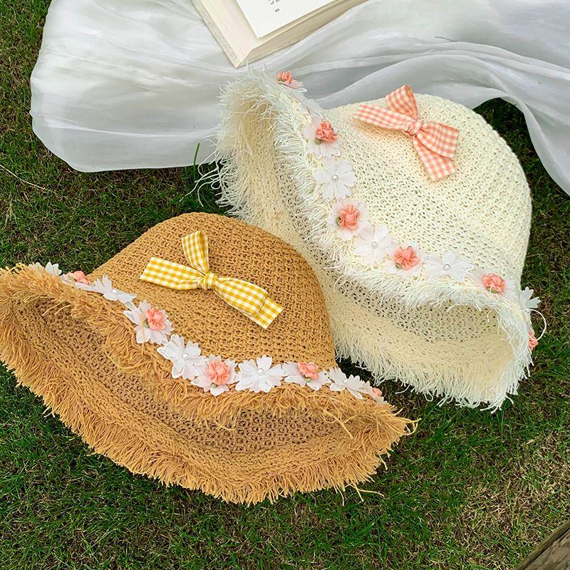 Kapelusz słomkowy pleciony z pustymi przestrzeniami w paski z kokardą i kwiatem dla kobiet, letni kapelusz chroniący przed słońcem do noszenia na zewnątrz, kapelusz rybacki