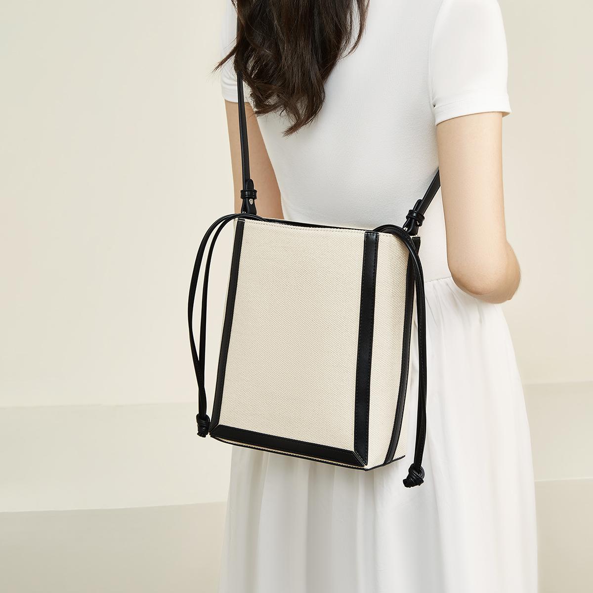 FOXER Minimalist Canvas Women s Shoulder Bag Large Capacity Lightweight Bucket Bag for Spring Commute and Daily Use