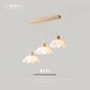 Nordic Modern Wood Art Light: Three-Head Dining Table and Bedroom Lamp in Japanese Wabi-Sabi Style.