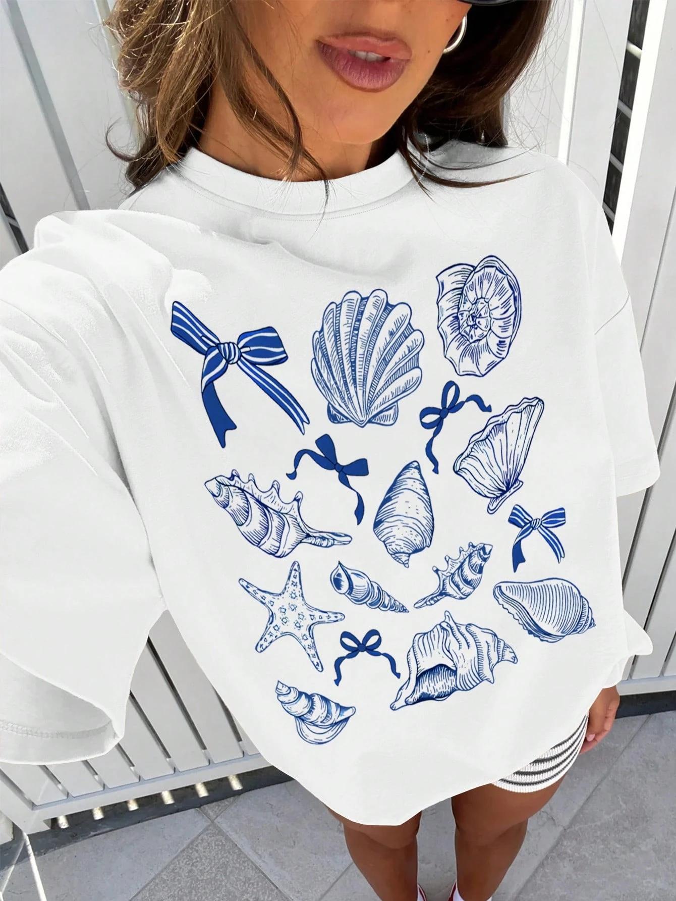 

Women s plus size T-shirt with blue sea shells print and bows for summer fashion S