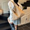 Retro portable bucket bag women's autumn and winter new large-capacity woven shoulder bag commuter tote bag