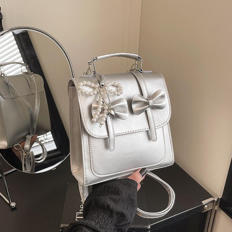 South Korea solid color college style commuter backpack women 2025 new trend bow portable shoulder messenger bag
