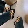French black thick-bottomed cool slippers women's 2025 summer new niche fashion simple metal one-word beach slippers