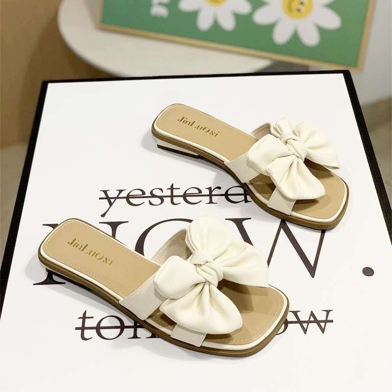 Low-heeled bow one-word drag women's summer wear flat-bottomed square-head slippers 2025 new seaside beach shoes