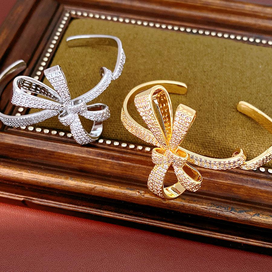 Ningguang Gold-Plated Zirconia Bow Cuff Bracelet: Luxury European-American Fashion Accessory