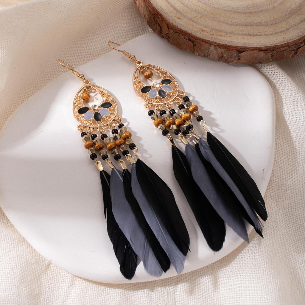 Retro ethnic style woven feathers long fringed earrings, bohemian high-end hollow rice bead earrings