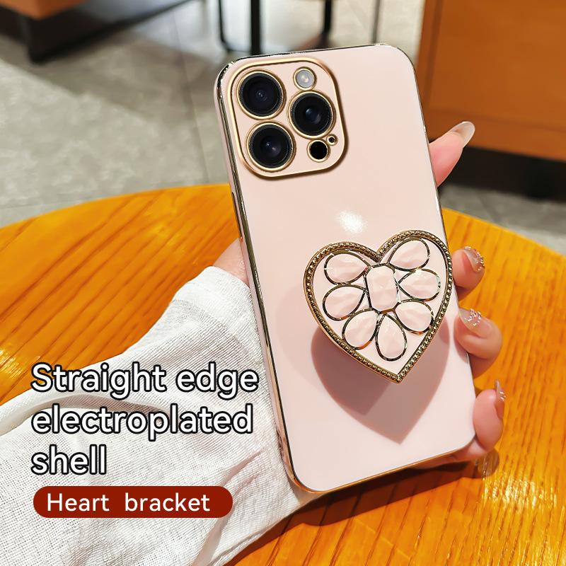 

Подходит для iPhone16 Гальванизированный Амортизирующий Чехол для Мобильного Телефона с Подставкой в Виде Сердца Apple 15proMax Противоударный 14 Мягкий Чехол iPhoneXSMax розовый