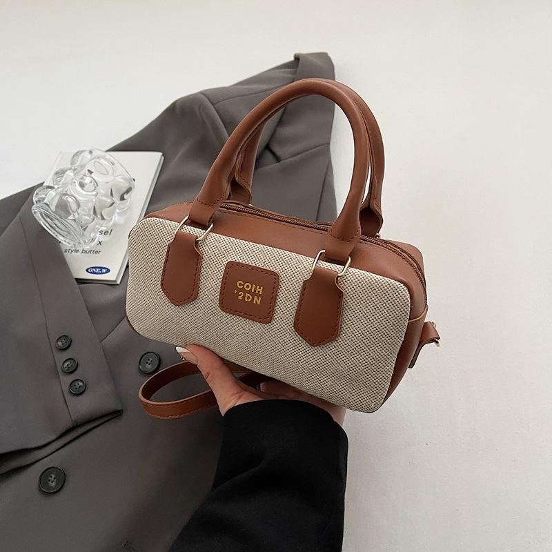 

Niche contrasting color bowling bag women s new high-end canvas handbag retro shoulder messenger bag