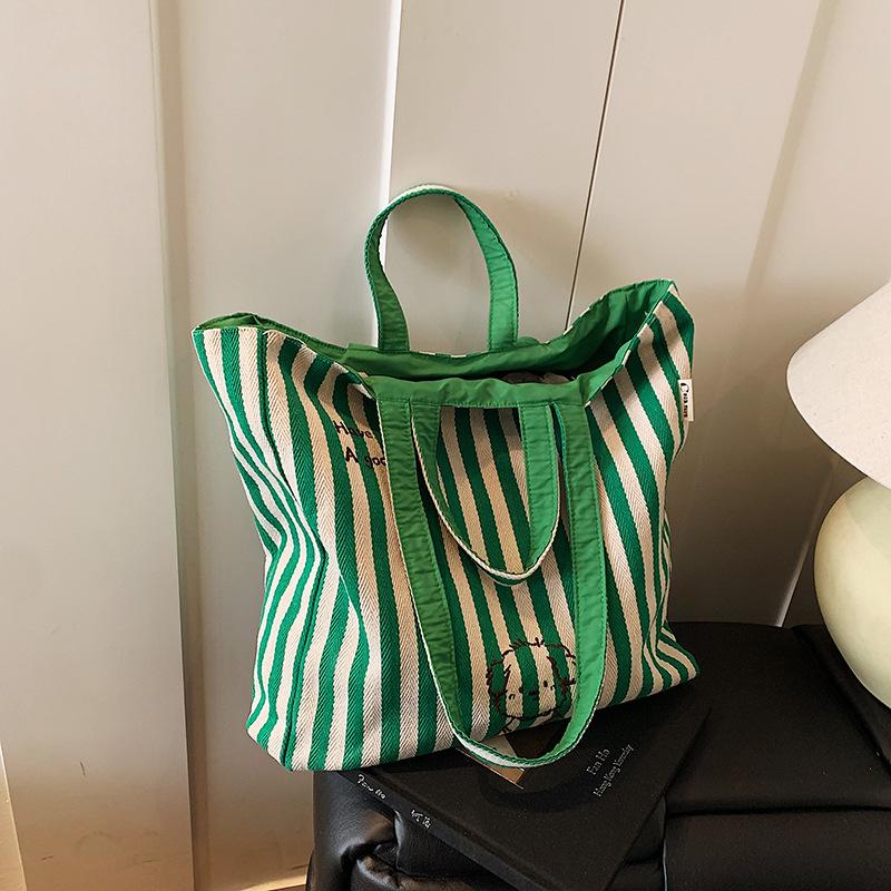 

2025 new niche letter simple shoulder canvas bag versatile cute puppy portable tote bag зелений