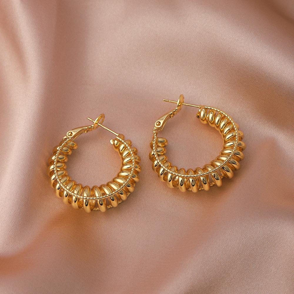 Women's High-End Light Luxury Twisted Hoop Earrings - Stylish, Colorfast, Exaggerated Design for Round and Square Faces.