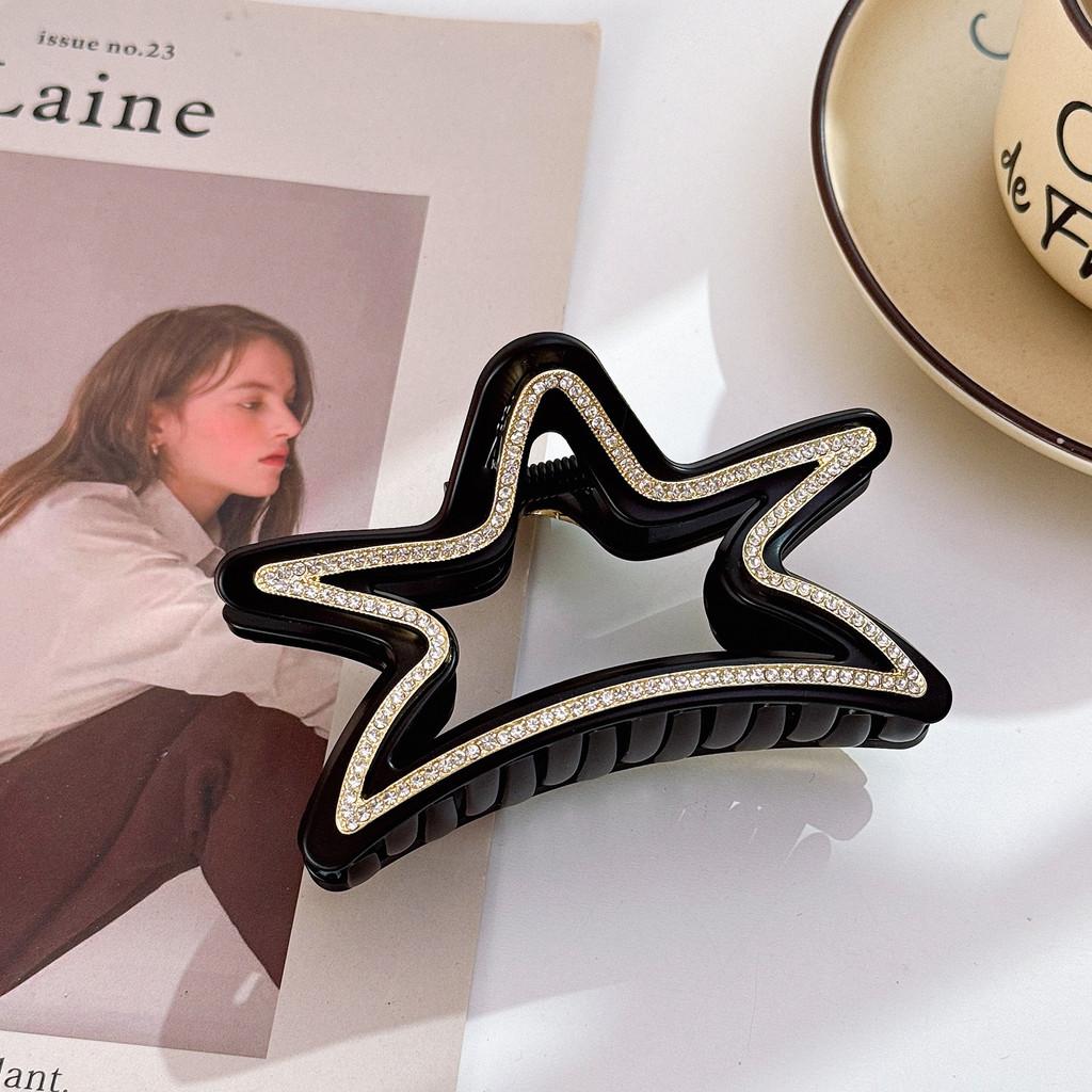 Elegant stjärnformad hårklämma för kvinnor med fantastiska strass i svarta och bruna toner