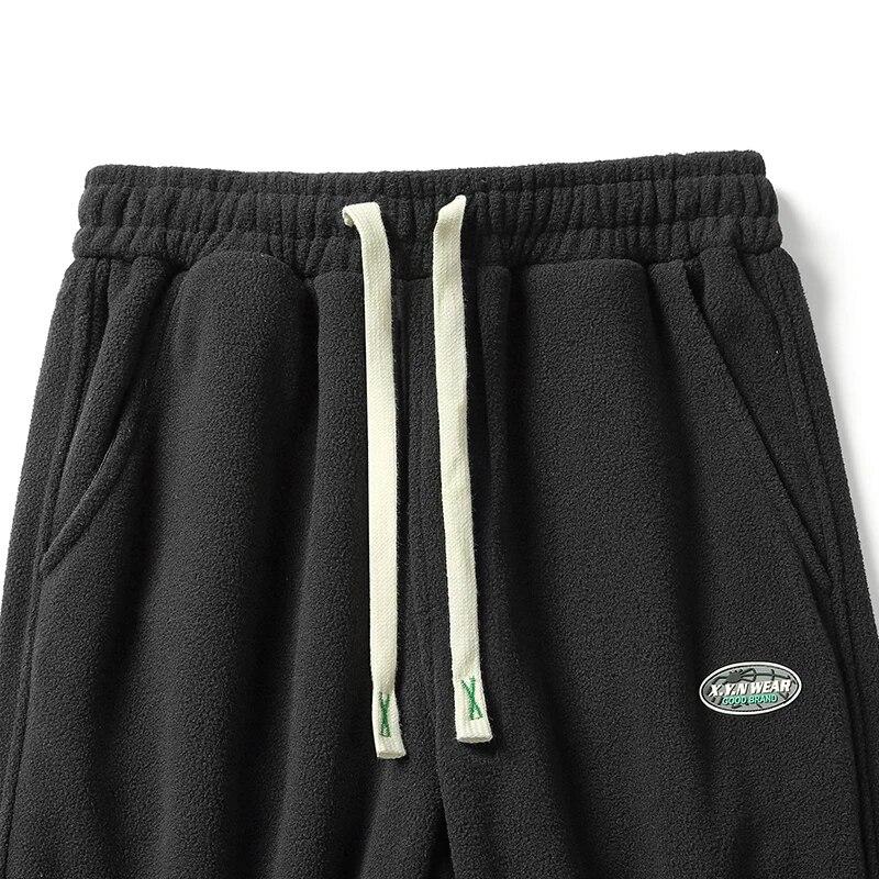 Зимние теплые утепленные спортивные штаны — фото 6