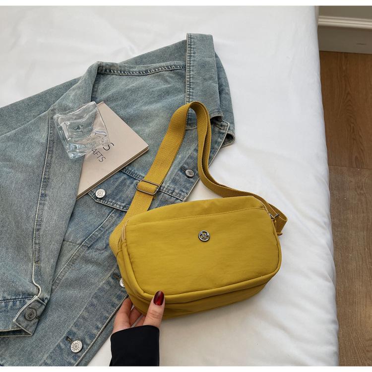 Casual new lightweight small square bag women's Korean version niche versatile solid color simple commuter student shopping messenger bag