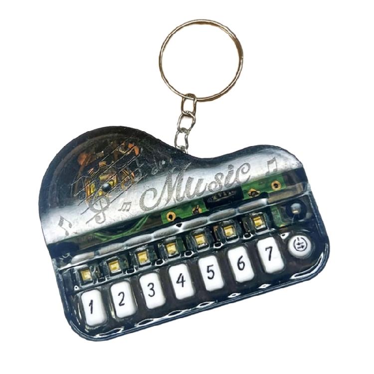 Pocket Sized Electronic Piano Keychain Toy With Multicolor Illuminated Keys Portable Music Learning Device For Children