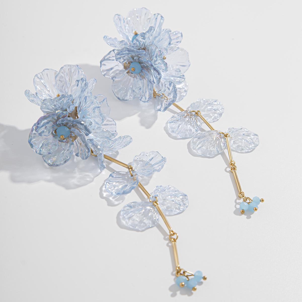 

Серьги-кисточки с цветочным узором и разноцветными гребешками — европейская и американская мода, все подходящие