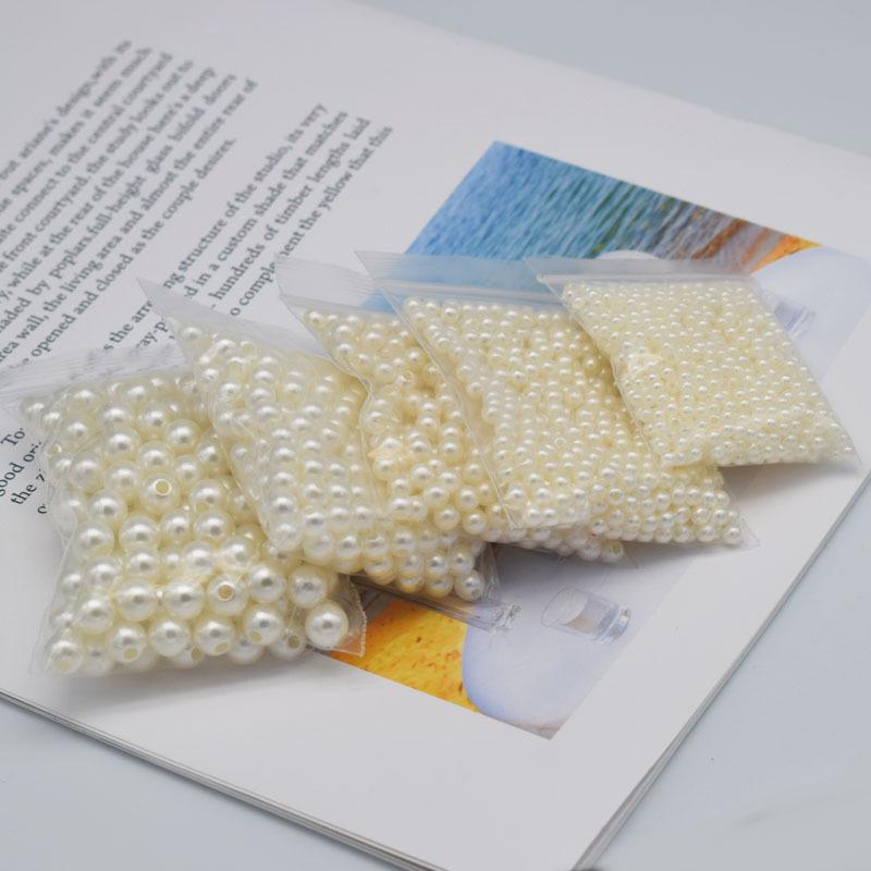 Koraliki z imitacji pereł w kolorze złamanej bieli z podwójnym otworem 4-20 mm do samodzielnego wykonania, opakowanie 50 g