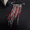 Retro Brooch Pin with Red Bead Accent and Flowing Tassels Detail Multi Chain Detail Alloy Corsage Stylish Enhancement