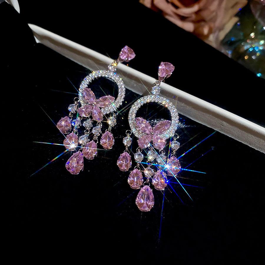 Silver Needle Diamond Inlaid Butterfly Tassel Earrings and Necklace Set: Elegant Hollow Design with Personality and Style.