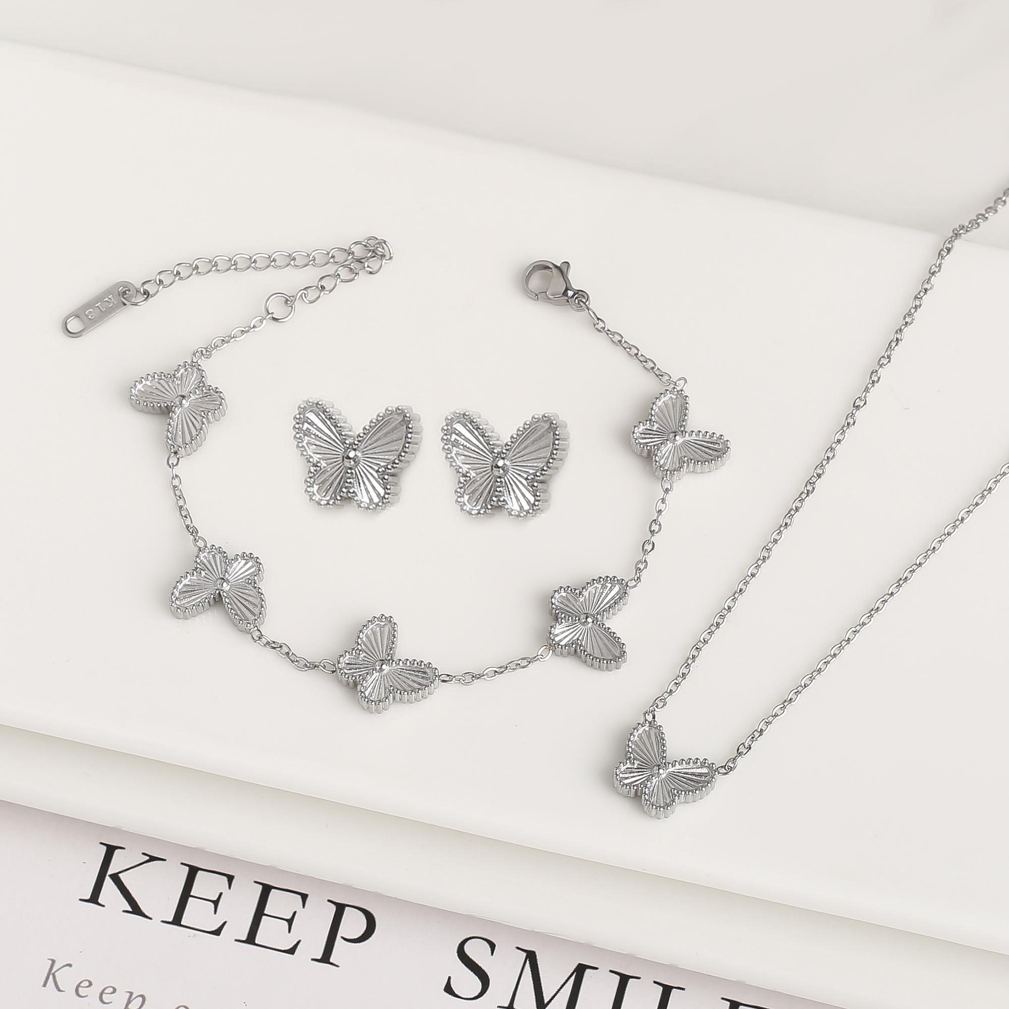 

Высококачественный Металл Нержавеющая Сталь Лазер Бабочка Циркон Набор Браслет Ожерелье Серьги Роскошный для Женщин Вечеринка Циркон Клевер