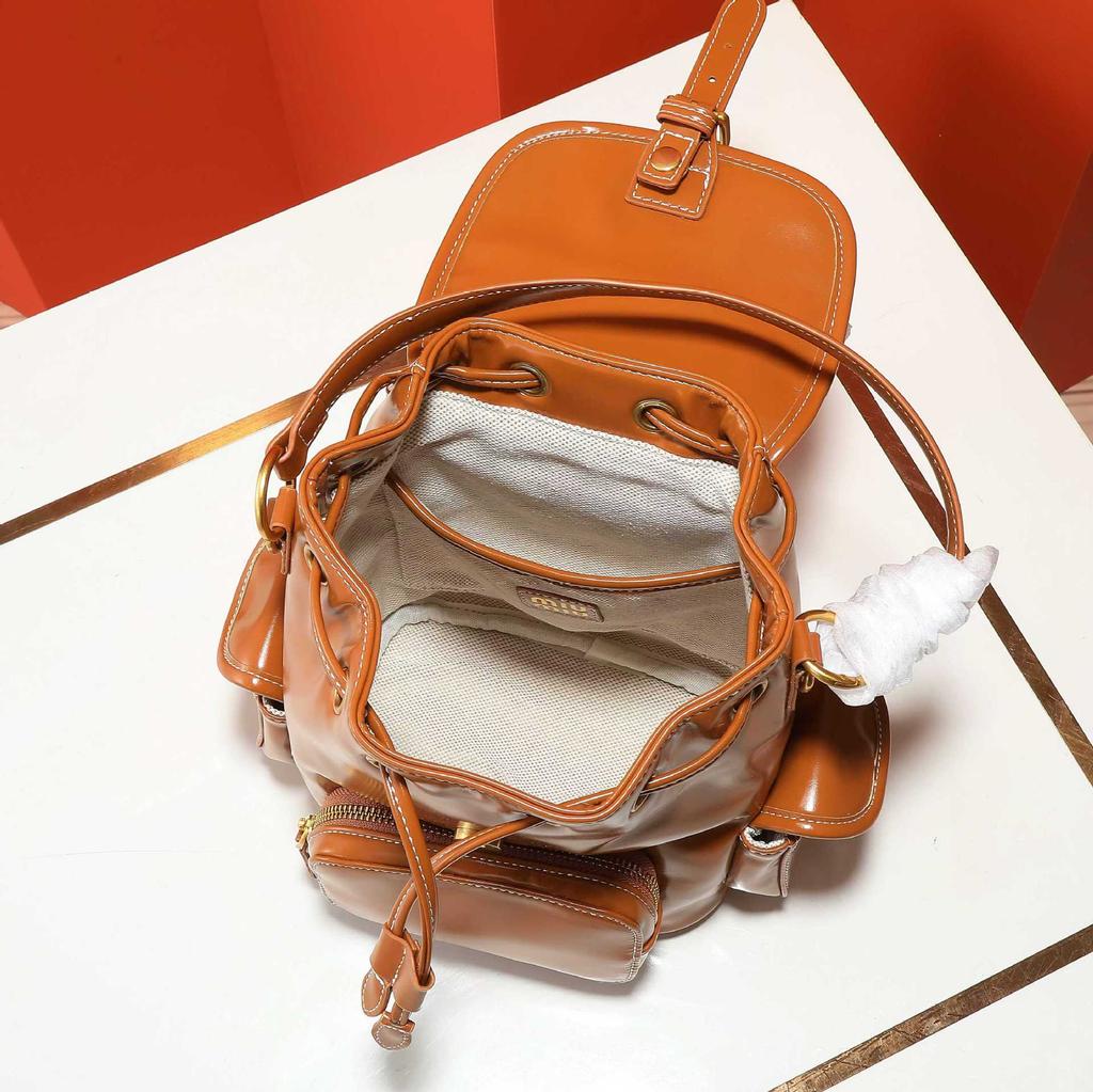 Nový Miao miu 2025 plátěný batoh velkokapacitní prémiový pocit všestranný přenosný ramenní cestovní dojížděcí batoh