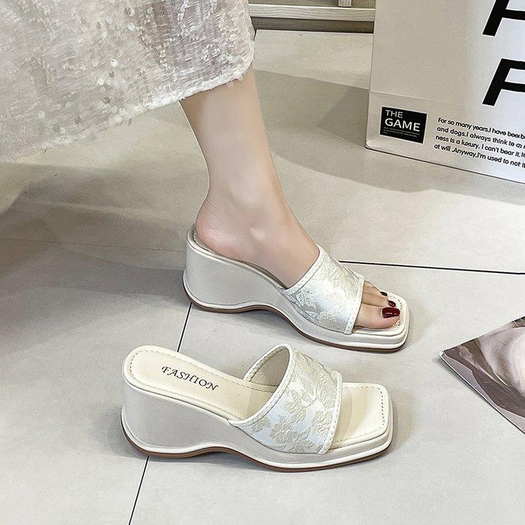 

Slope heel new Chinese one-word slippers women s wear 2024 new summer fashion temperament soft bottom vacation seaside sandals 40