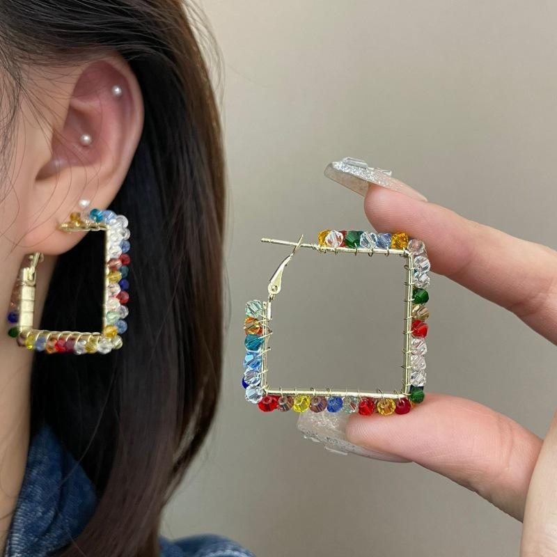 

Hand-woven colored crystal earrings, silver needle earrings, personalized atmospheric earrings. 925 silver needle