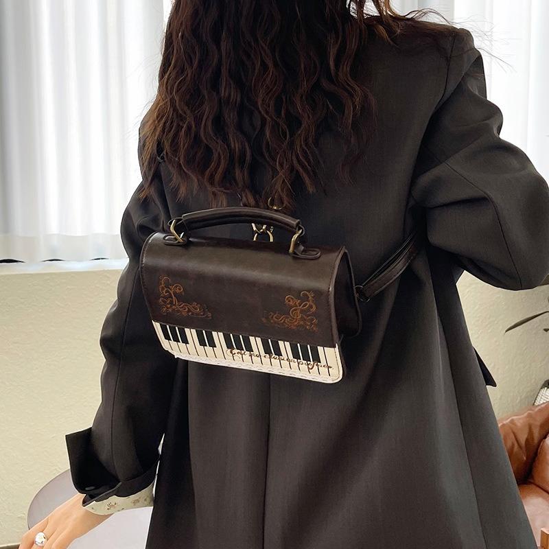 Bolso de mensajero de encaje de piano literario retro de alto valor, bolso de mano versátil, mochila simple, maletín, bolso de hombro