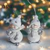 Winter Atmosphere Table Decor 2Pcs Christmas Snowman Figurine, Cute Tabletop Decor, Resin Snow Statue with Gift for Friends Knit Hat Scarf Home Mantel