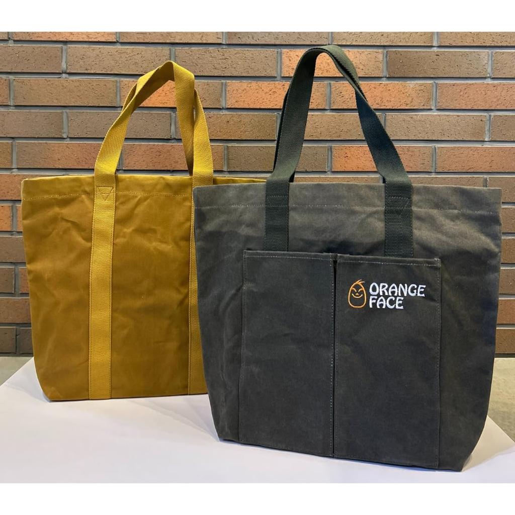 Waterproof canvas tote bag with large capacity, paraffin-coated finish. Perfect for casual wear, camping, or commuting. Perfect for men, women, and