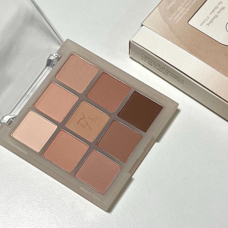 DIKALU Nine-Color Milk Tea Eyeshadow Palette: Acrylic Nude Series with Shimmer & Matte Finish.