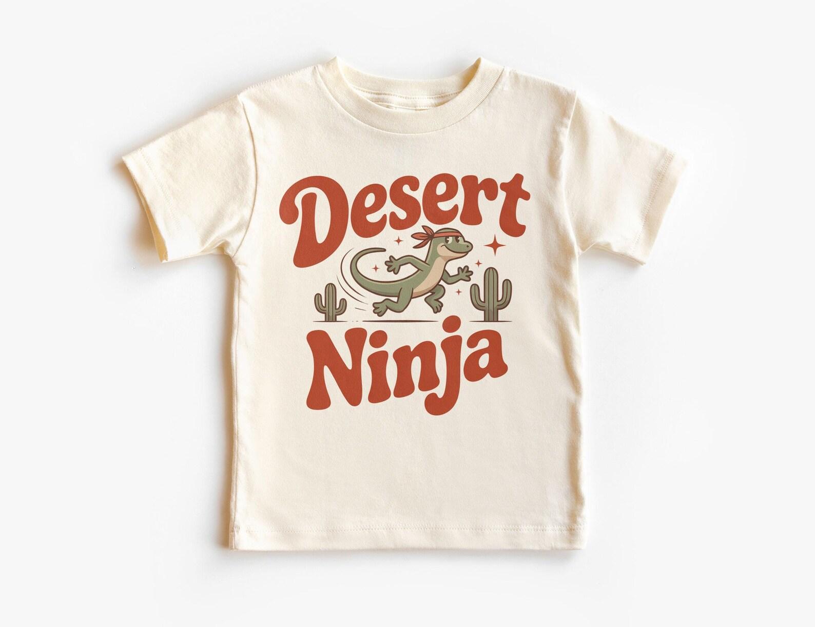 Retro Desert Ninja Lizard Kids Graphic T-Shirt – Reptile Lover Unisex Top – Southwestern Cactus T-Shirt – Funny Animal Kids Tee 100