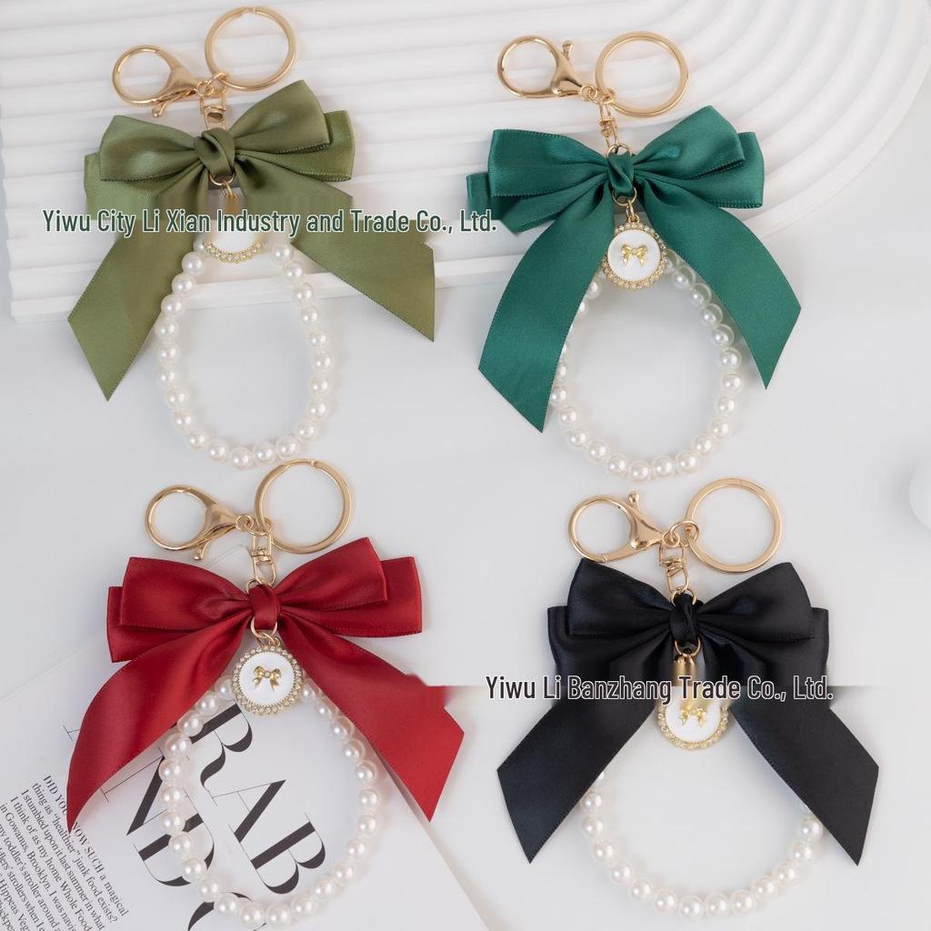 Large Bow Faux Pearl Bracelet Keychain with Colored Woven Strap and Alloy Tag Pendant