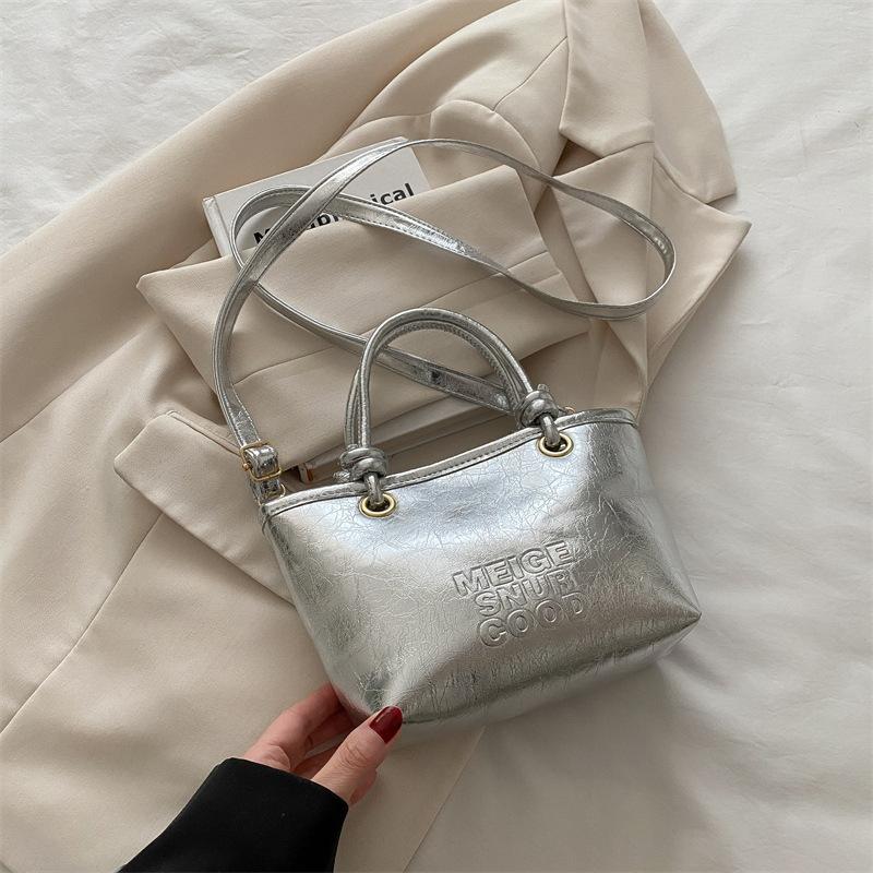 

Casual versatile fashion hand bucket bag 2025 summer new women s shoulder bag PU texture foreign style messenger bag срібний
