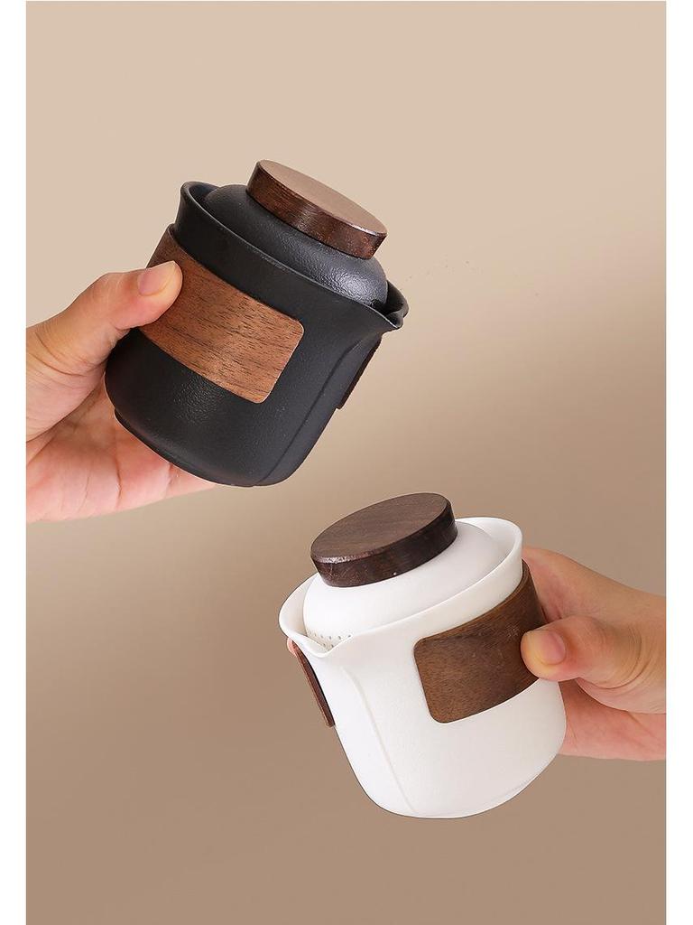 Portable Travel Tea Set: Teapot, Four Cups, and Storage Bag for Outdoor Camping.