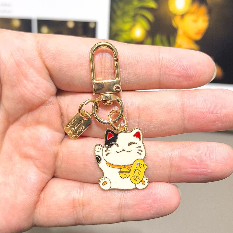 

New Year s Ins Simple Japanese and Wind Fortune Cat Keychain Cherry Blossom Bag Accessories Fashion Toys Anime Cartoon Frind